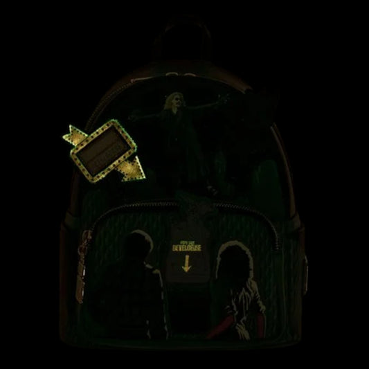 Backpack with glowing Beetlejuice Graveyard graphic design in the dark