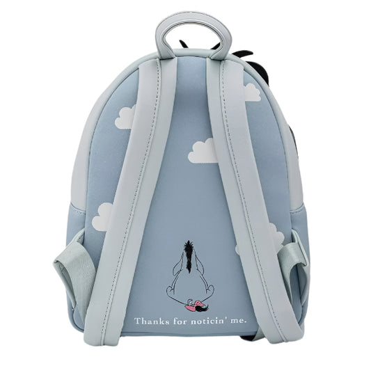 Backpack with cloud pattern and Eeyore on a light blue background. Images states 'Thanks for noticin' me.'