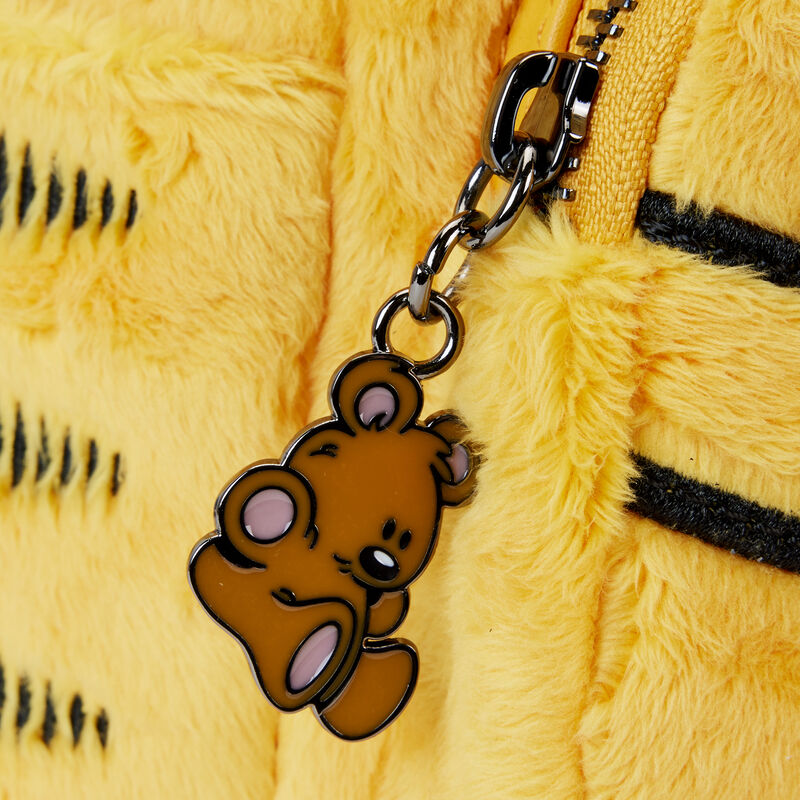 Brown bear Pooky zipper charm on a yellow plush toy with black stripes