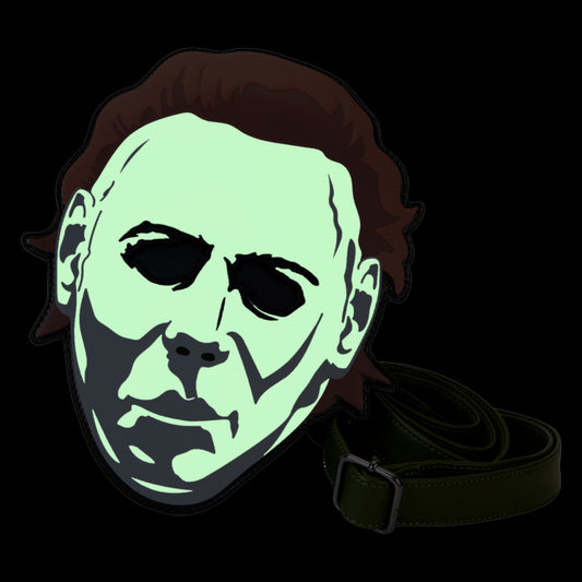 Glowing green Michael Myers Mask crossbody bag with a strap on a black background