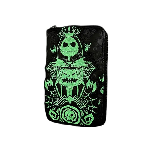 Glowing green Nightmare Before Christmas Black Disney Wallet on a black pouch against a white background