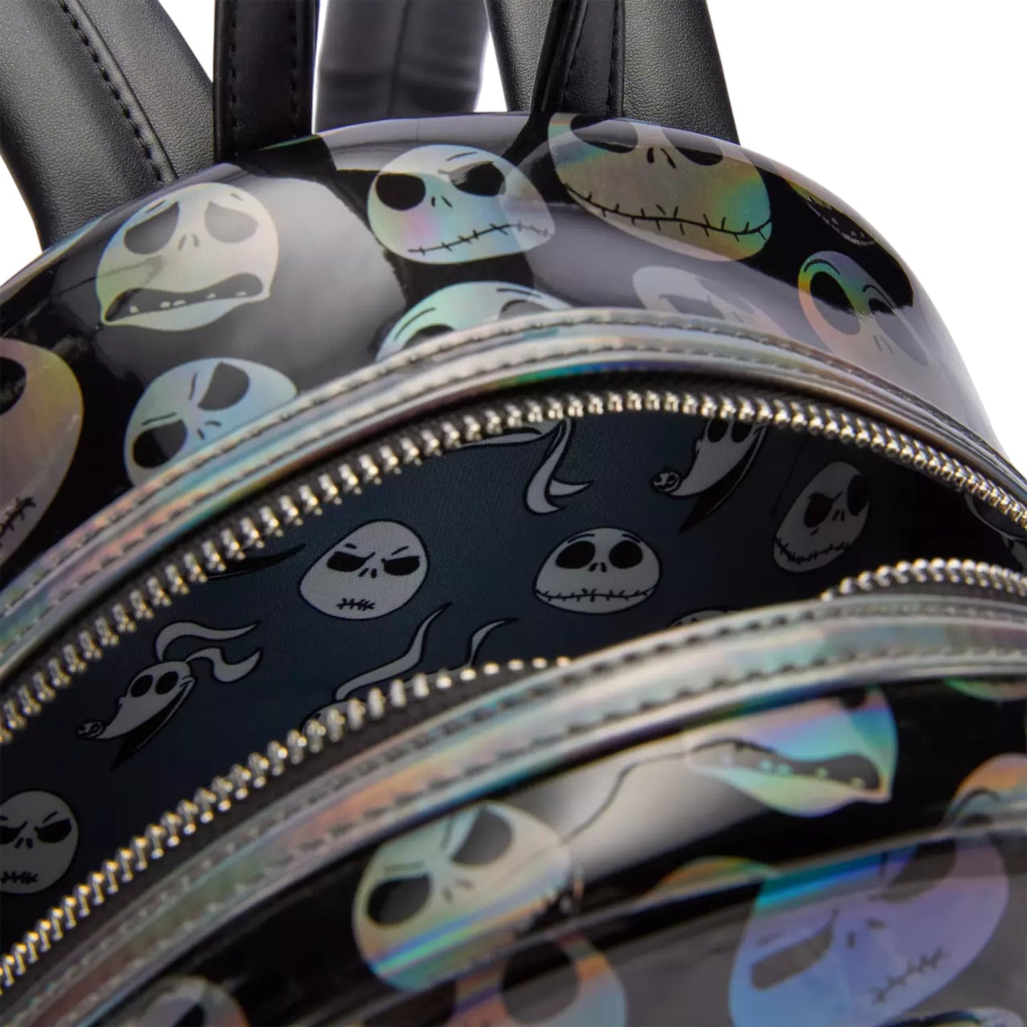 Backpack with jack skellington head pattern and reflective accents
