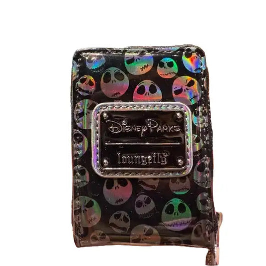 Accordion wallet with colorful Jack Skellington pattern and Disney Parks logo held in a hand.