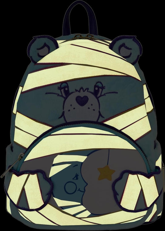 Glowing Care Bears x Universal Monsters Bedtime Bear Mummy Mini Backpack with Care Bear character wrapped as a mummy on a black background
