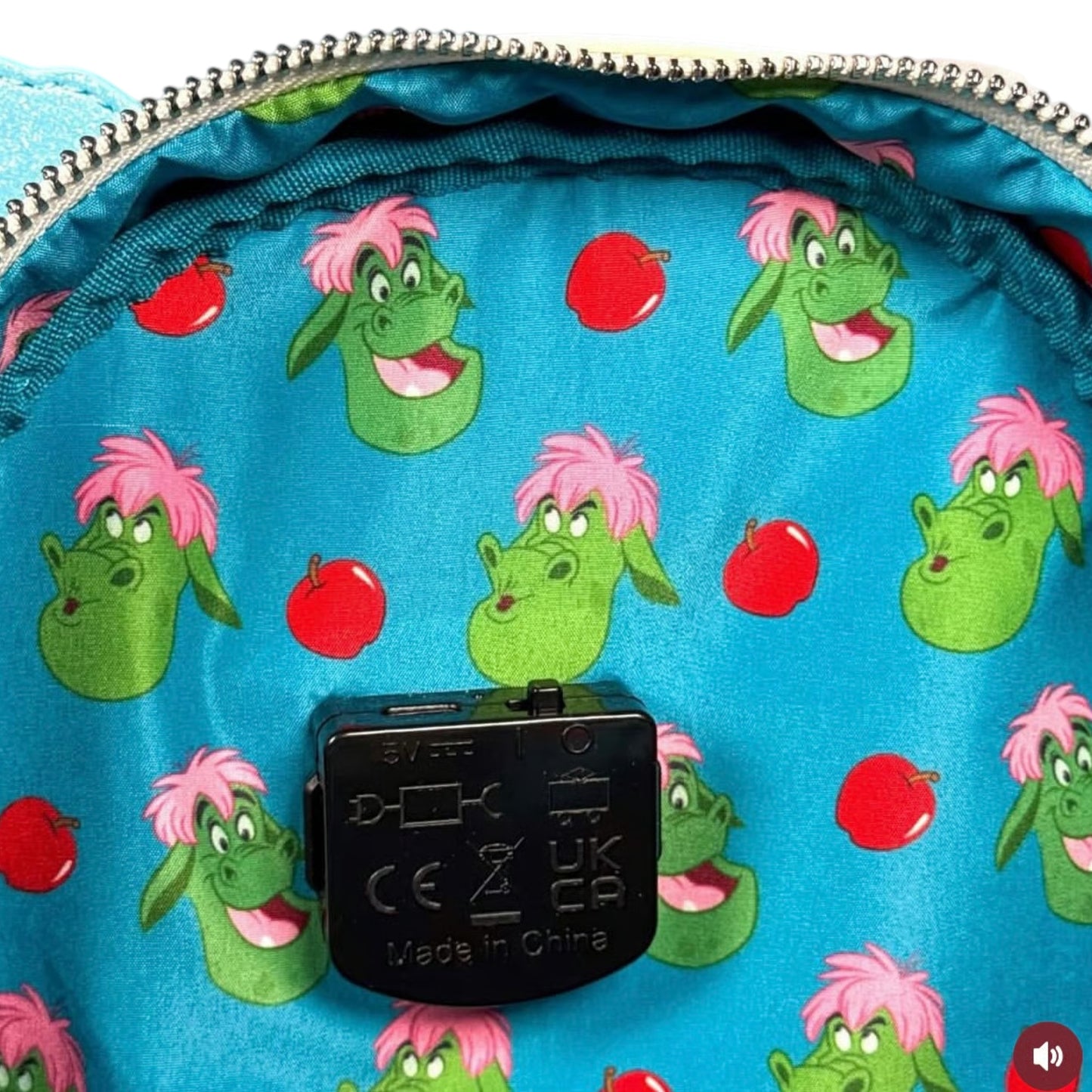 Close-up of a blue backpack with Elliott character pattern and visible brand label.