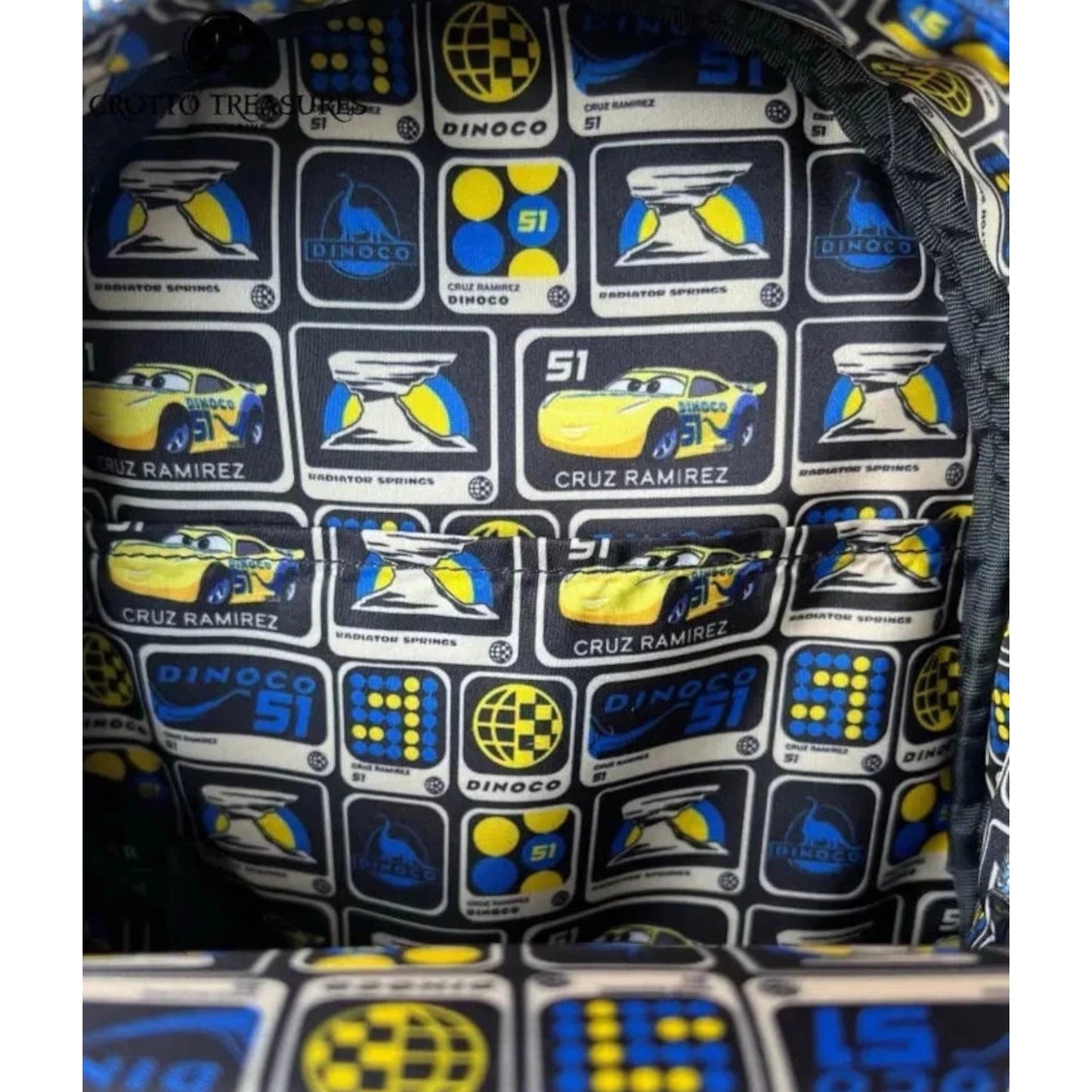 Close-up of onside of Yellow Loungefly Disney Pixar Cars Cruz Ramirez Cosplay Mini Backpack with racing car and logo pattern
