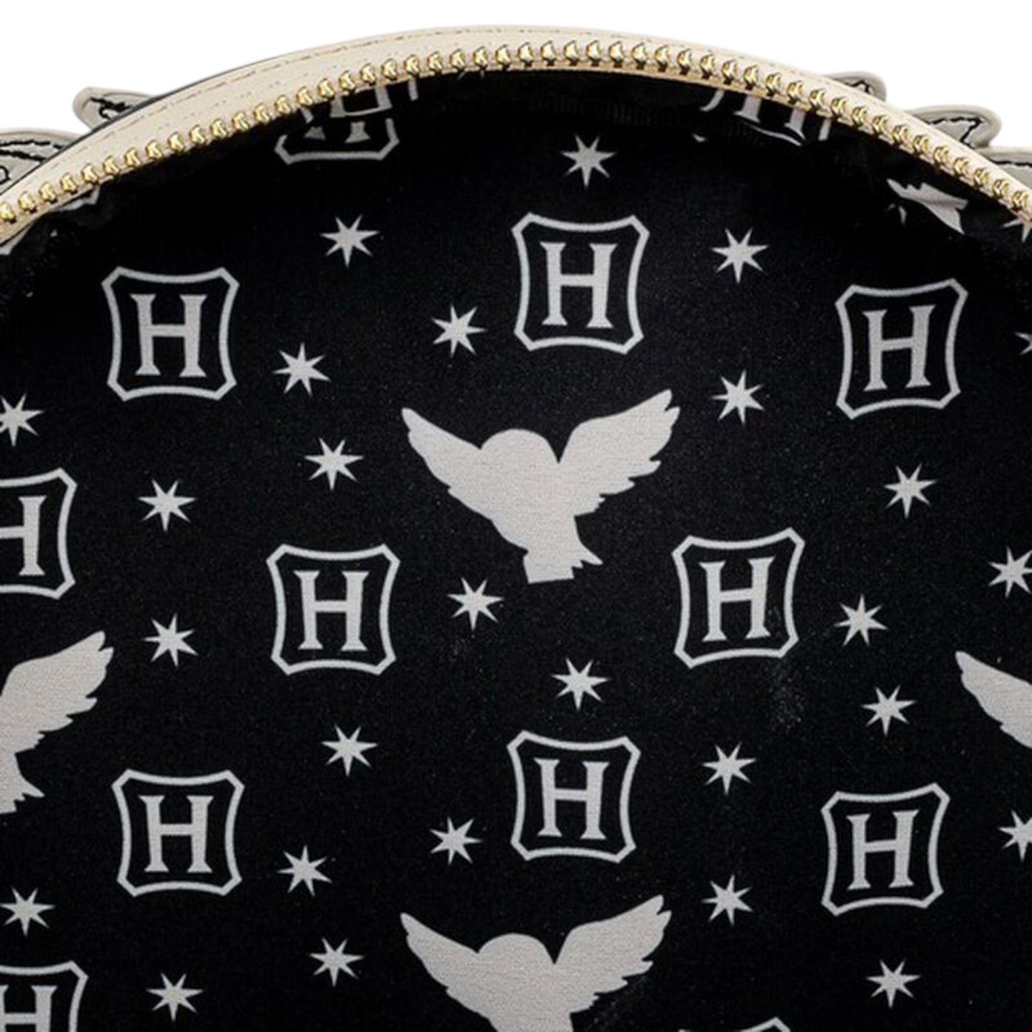 Inside of Harry Potter Hedwig Howler Cosplay Mini Backpack with white 'H' logo and owl character pattern on a black background