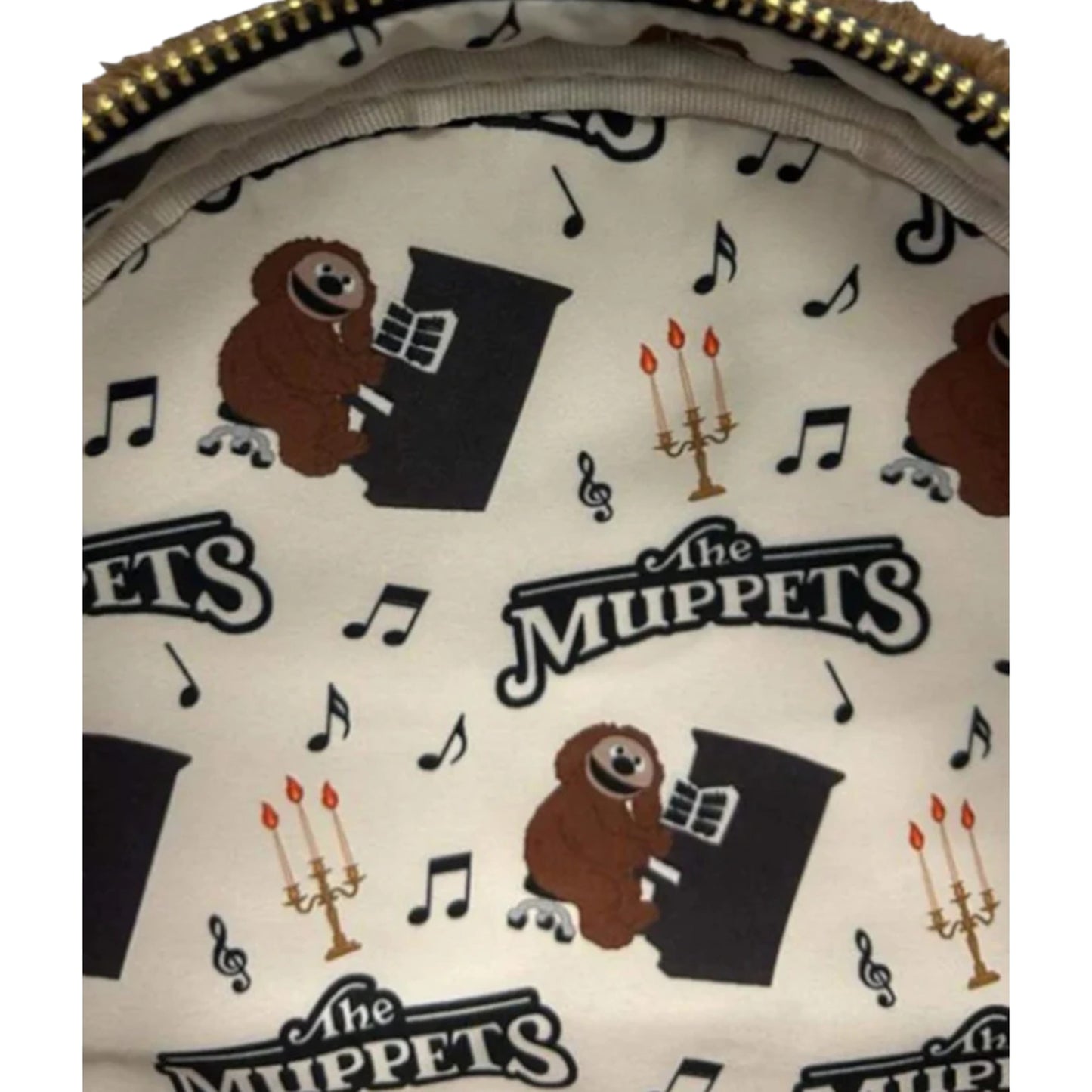 Close-up of a patterned product with 'The Muppets' and Rowlf character illustrations.