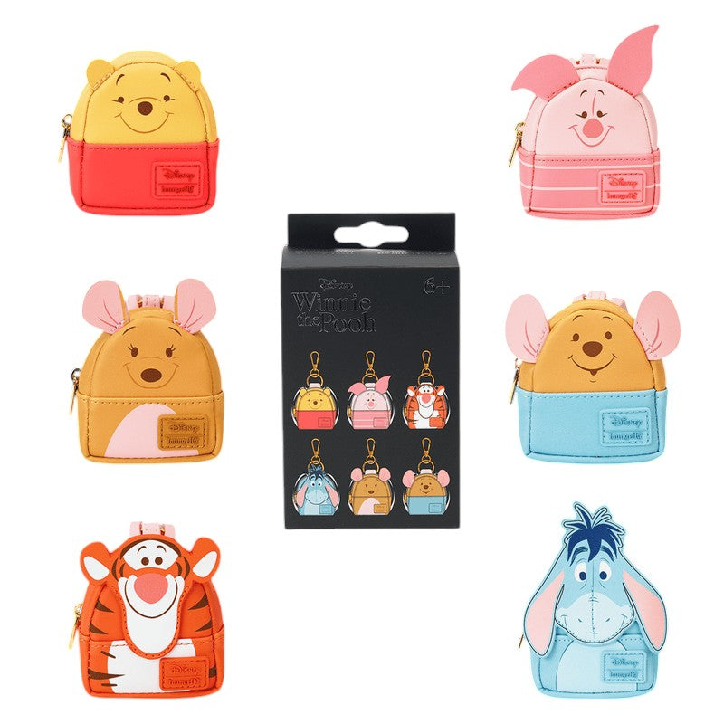 Collection of Loungefly Winnie The Pooh Mystery Box Mini Backpacks Bag Charms on a white background.