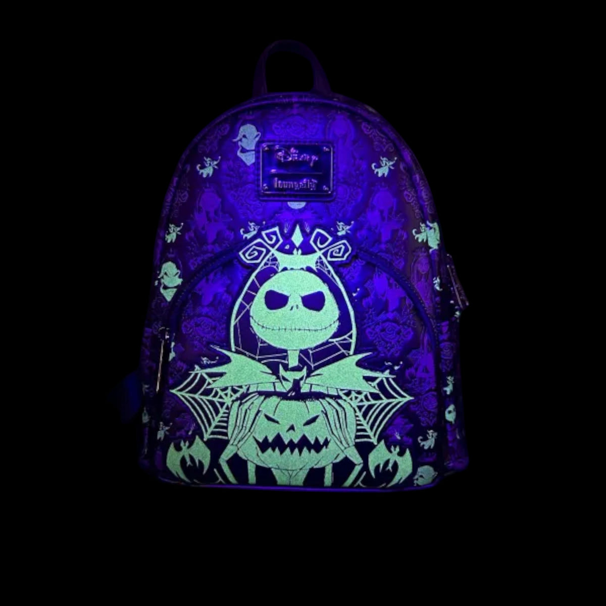 Glowing Backpack with Nightmare Before Christmas-themed design featuring a jack Skellington and jack-o'-lantern on a black background