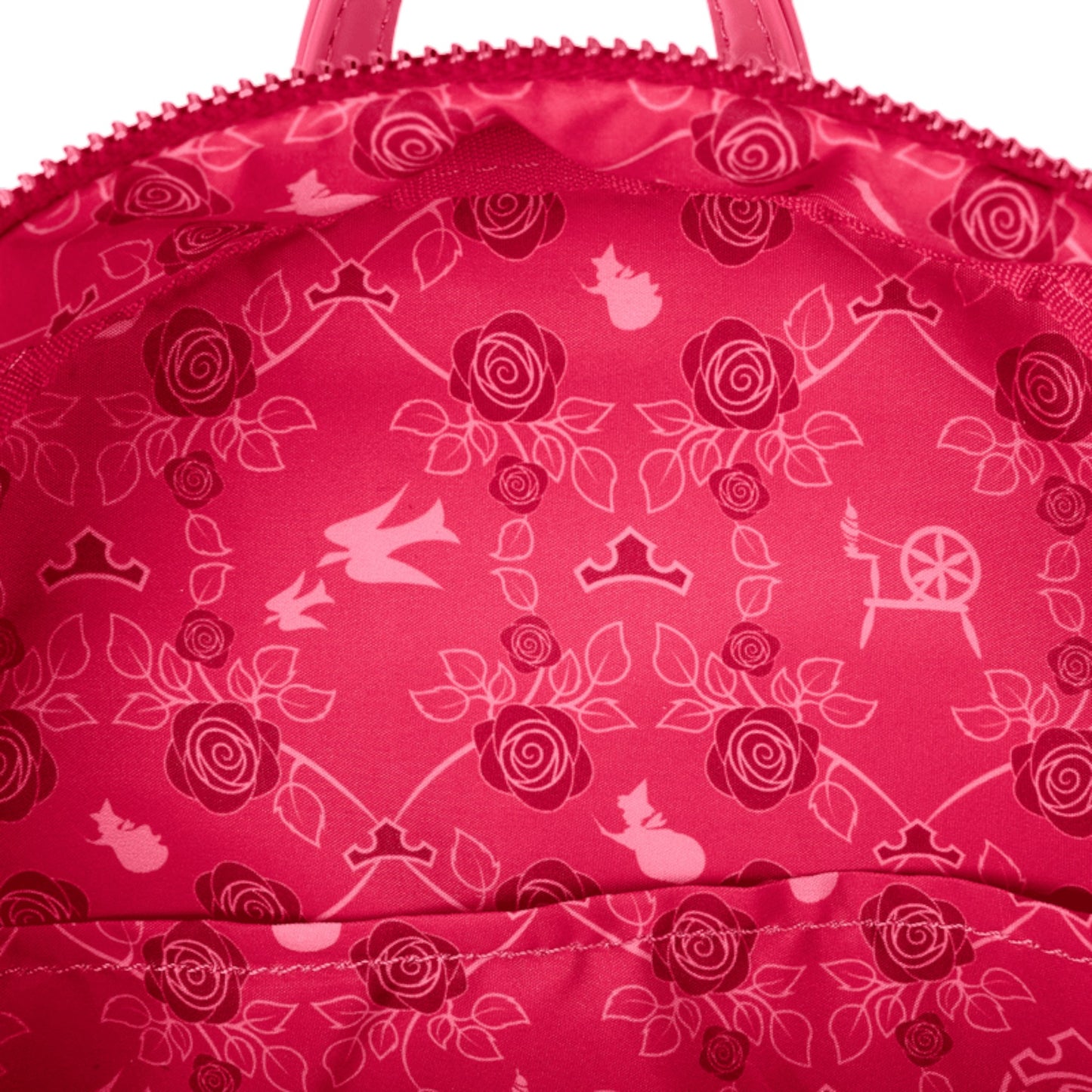 Close-up of a pink bag with white floral and castle pattern
