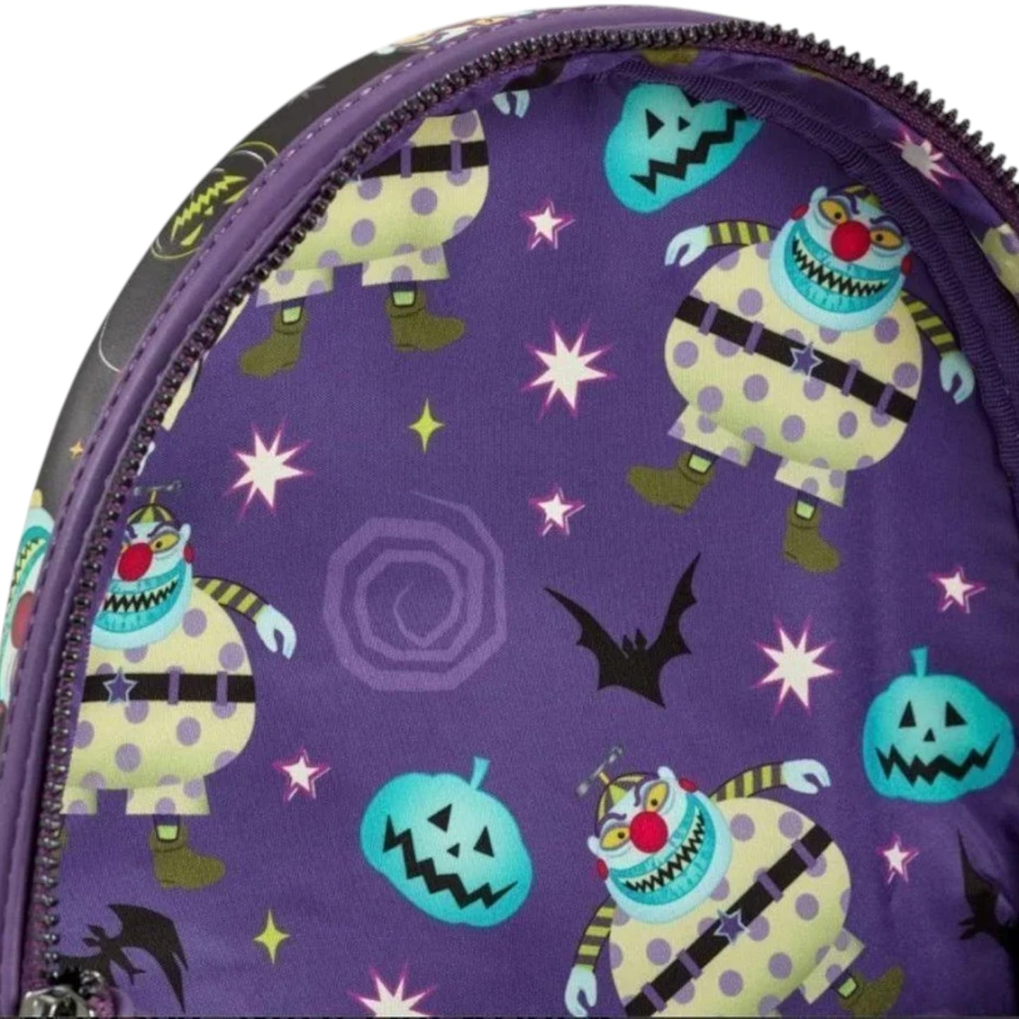 Inside of Colorful Loungefly The Nightmare Before Christmas Clown Mini with clown, pumpkin, bat, and other symbol designs on a purple background.