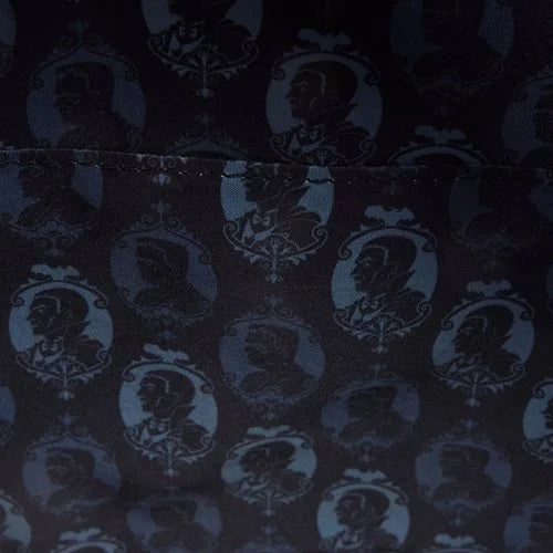 Inside of Loungefly Universal Monsters Dracula & Frankenstein Crossbody Bag with dark fabric with a pattern of Dracula & Frankenstein silhouettes in a repeat design