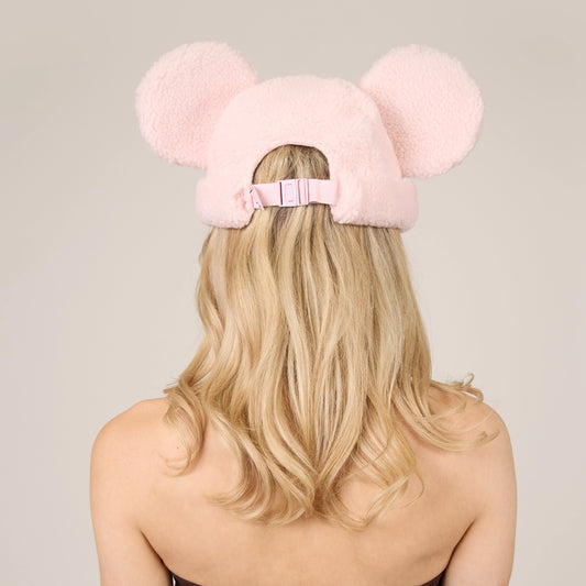 Person wearing a Mickey Sherpa Beanie Blush with Mickey ears on a plain background
