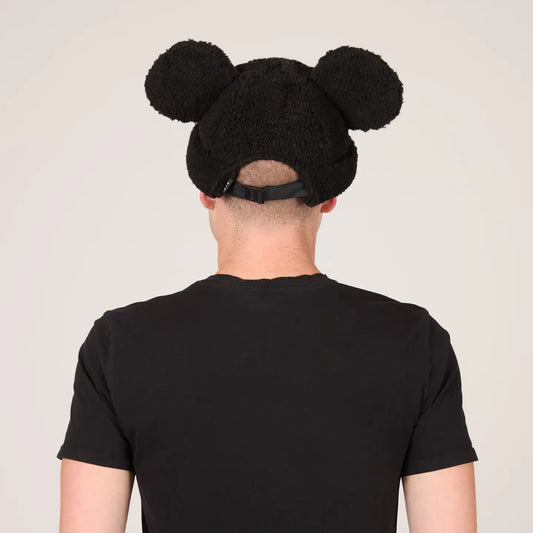 Person wearing a Mickey Sherpa Beanie Classic Black with Mickey ears on a plain background