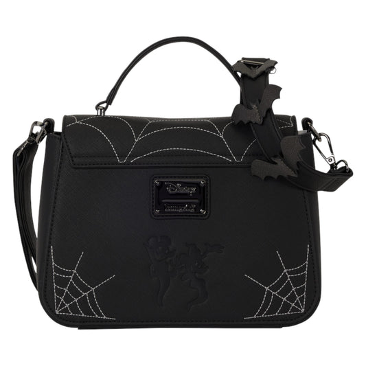 A black gothic-themed handbag featuring spiderweb embroidery, a top handle, and a detachable shoulder strap adorned with a bat charm. The front has a black plaque and an embossed figure.