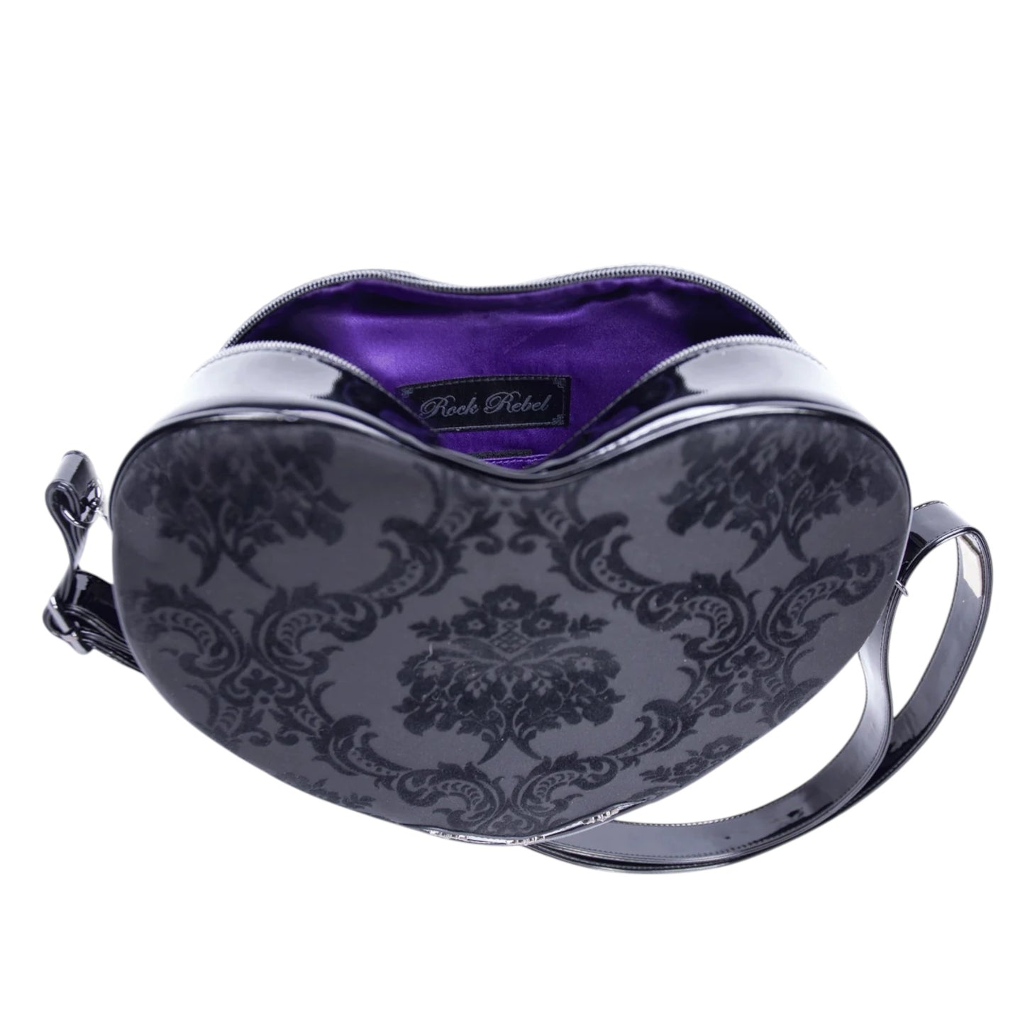 Heart-shaped handbag with purple interior and black floral pattern on a white background