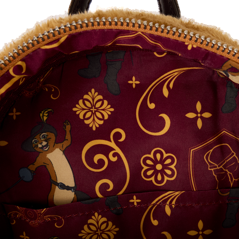Close-up of a bag with Puss in Boots design on a maroon background.