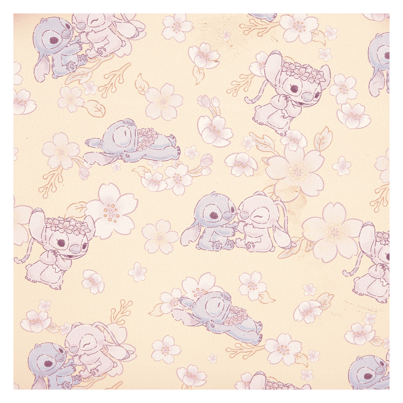 Pattern of Stitch & Angel Cherry Blossom characters and flowers on a light yellow background