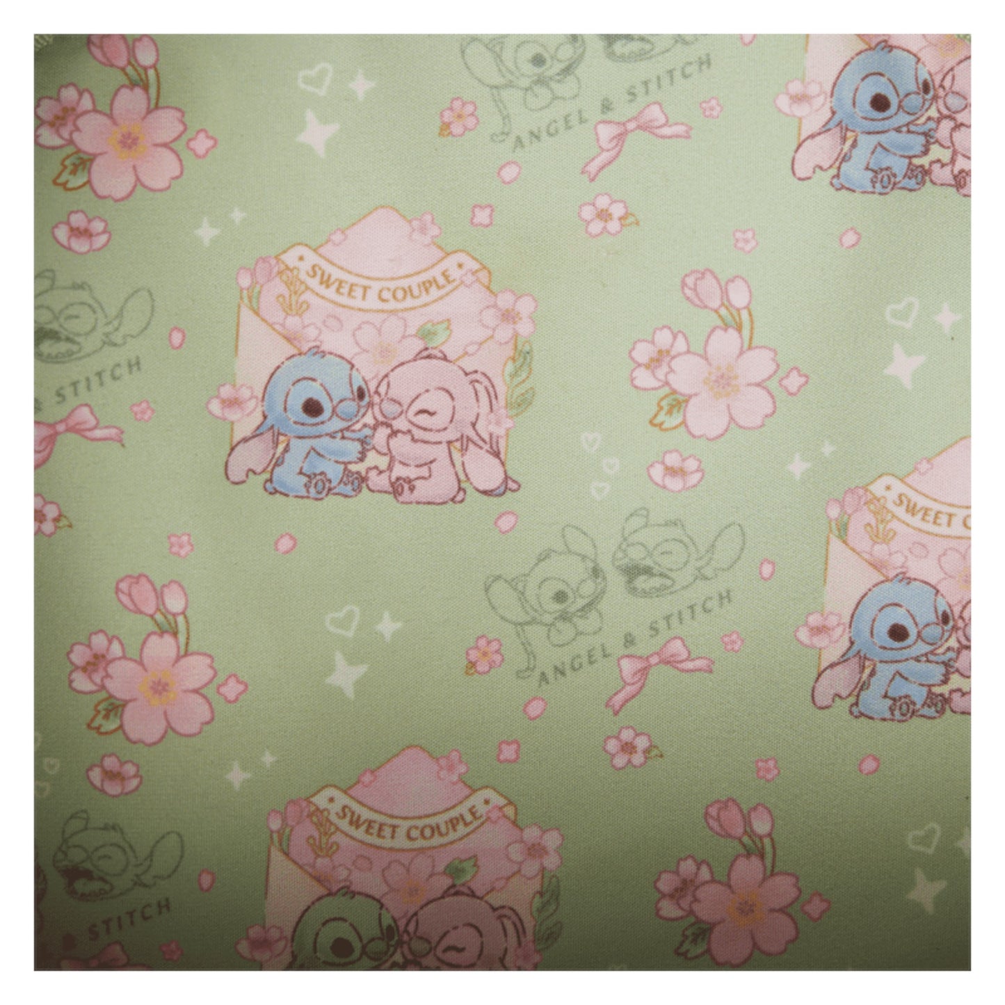 Patterned paper with Stitch & Angel Cherry Blossom characters and floral designs on a green background