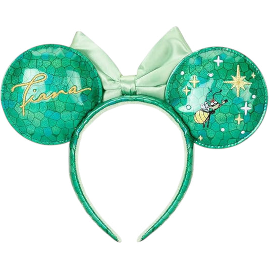 Green Minnie Mouse ears with bow and 'Tiana' text on a stained glass design on a white background