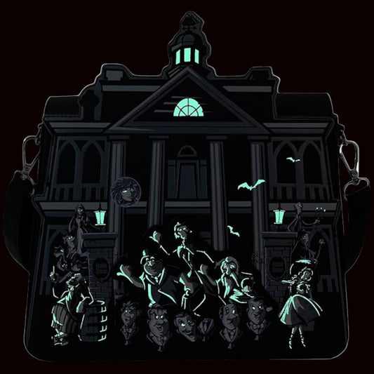 Glowing green silhouette of a haunted house with ghosts and skeletons on a black background