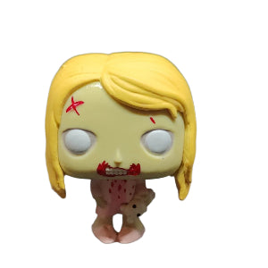 Toy figure of Teddy Bear Girl with blonde hair and a distressed expression on a white background