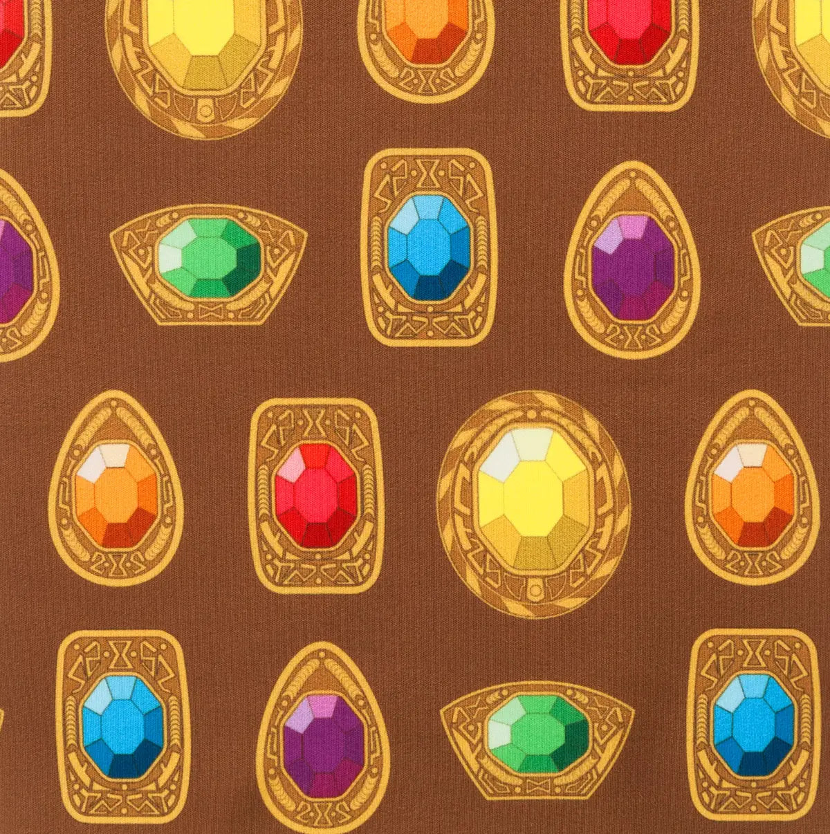 Pattern of colorful gemstones in gold frames on a brown background