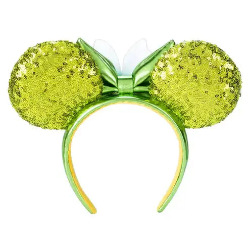 Green glittery mouse ears with a bow on a white background