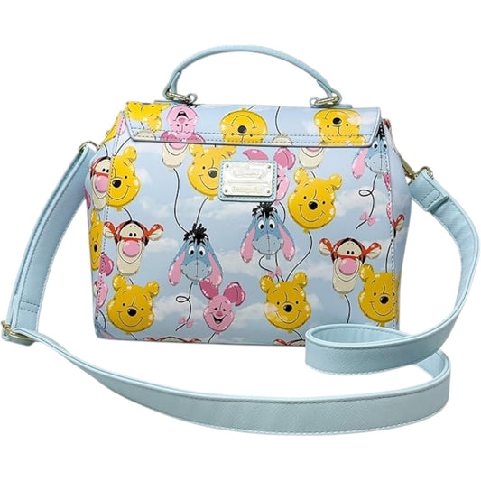 Winnie the Pooh Balloon Friends character handbag with a light blue strap on a white background