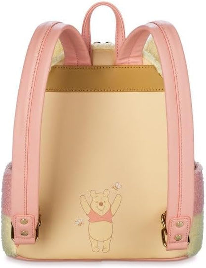 Pink and gold backpack with Winnie the Pooh character on a white background