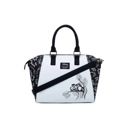  Alice In Wonderland Black & White Satchel Bag with black floral pattern and white front panel featuring gnCheshire Cat desi, on a white background.