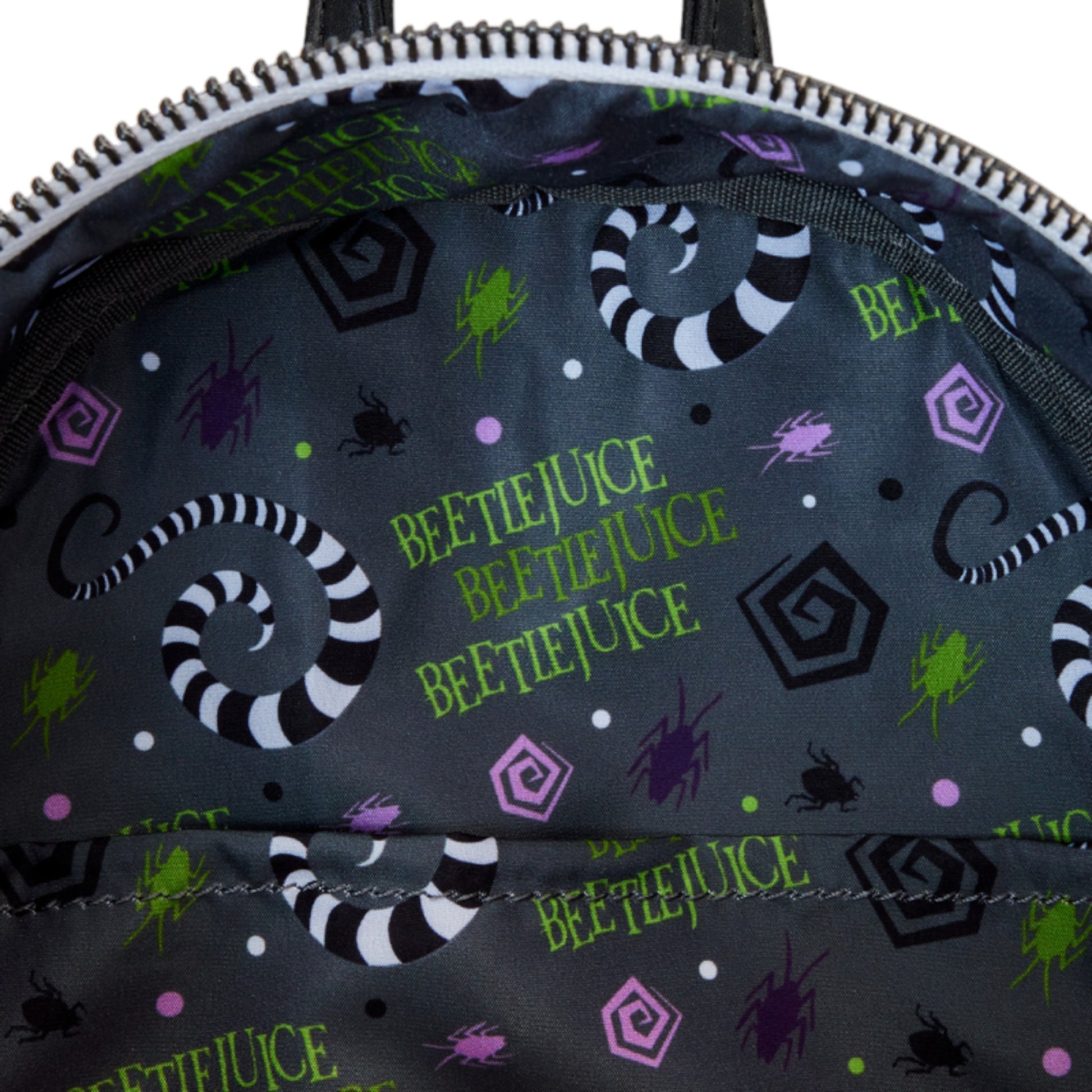 Backpack with sandworm pattern featuring Beetlejuice text and graphics on a dark background