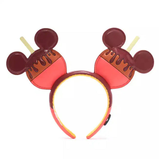 Mickey Mouse headband with chocolate candy apple design on a white background