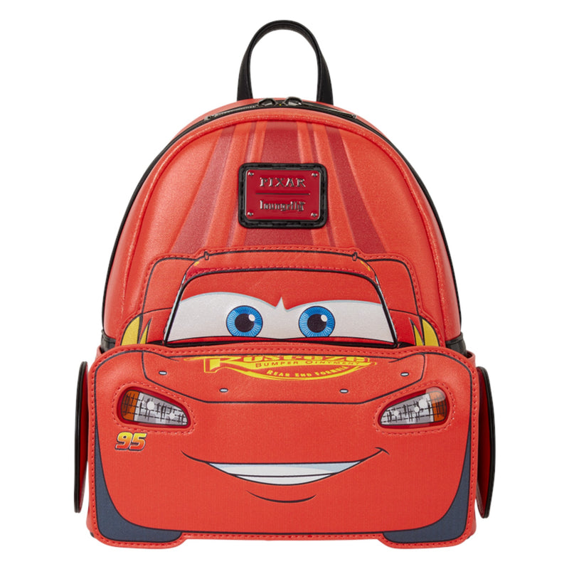 A red Lightning McQueen themed mini backpack by Disney, featuring a 3D-effect face design with blue eyes, a yellow grille, and the number 95, on a solid white background.