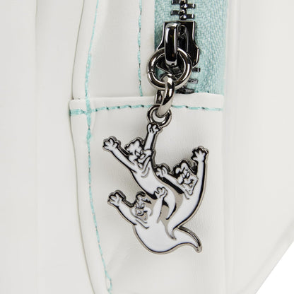 Close-up of a silver ghost charm on a white and light blue checkered bag.