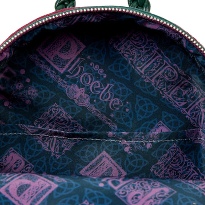 Close-up of a backpack interior with a patterned lining featuring the brand 'Phoebe'.