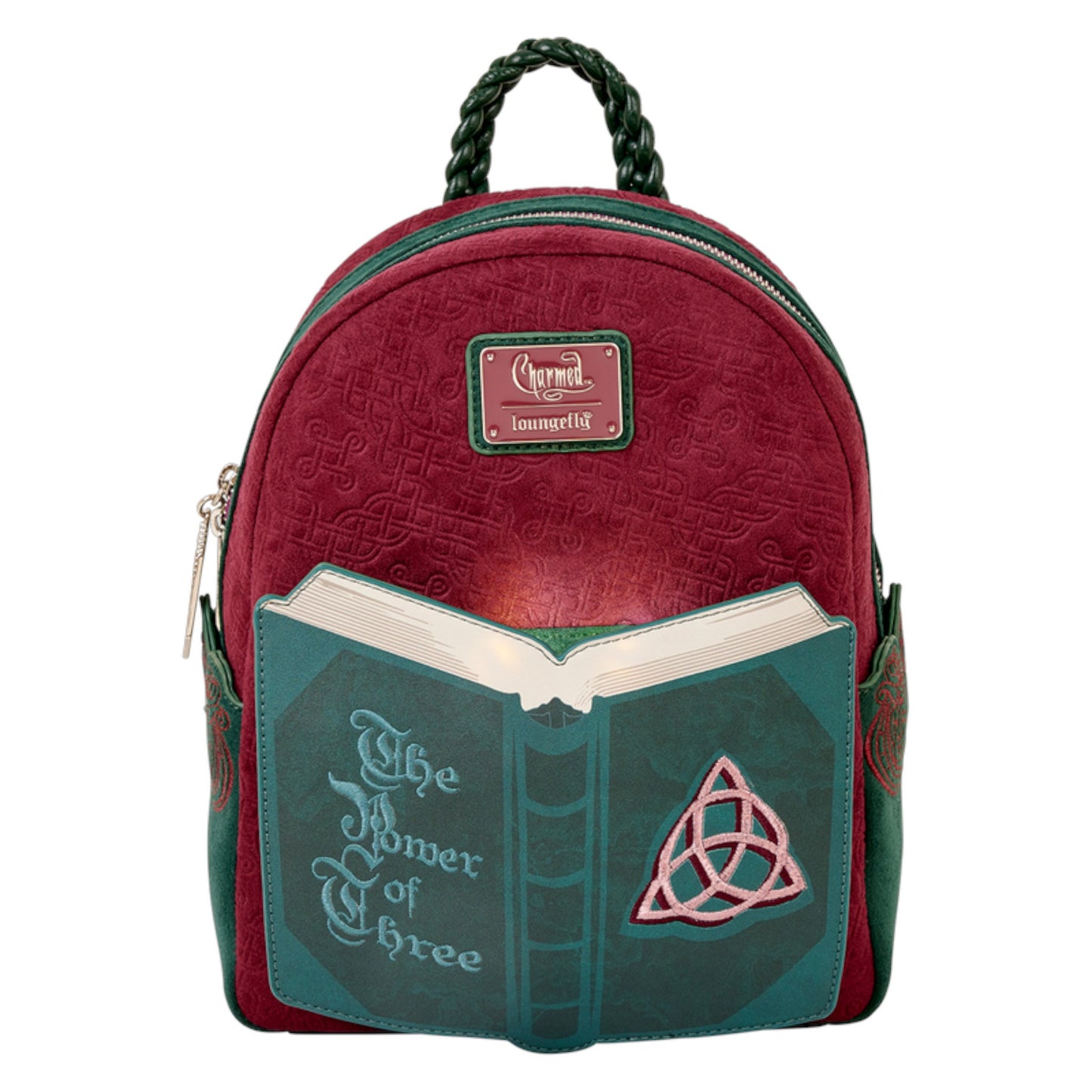 Charmed Book of Shadows backpack with book design and 'The Power of Three' text on a white background