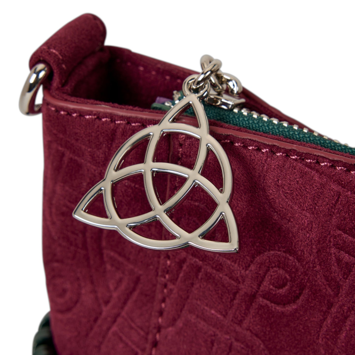 Maroon pouch with a silver Celtic knot zipper charm on a white background