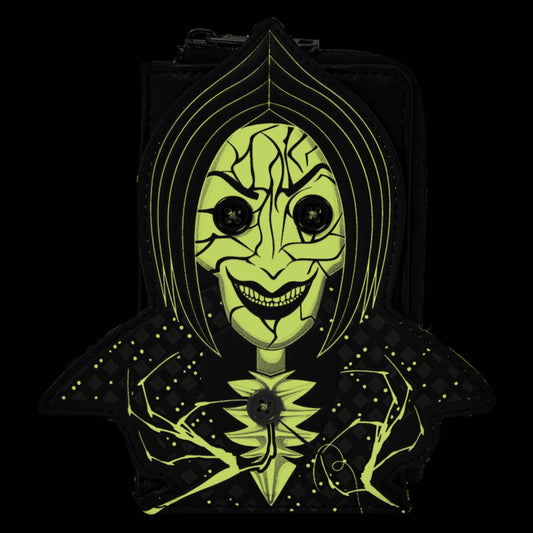A black hooded bag or pouch featuring a stylized neon yellow-green face graphic with cracked facial features, large black eyes, and a wide grin, shown against a solid black background.