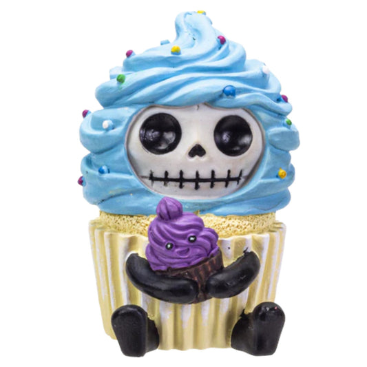 Cupcake-shaped figurine with skeleton face and purple character on a white background