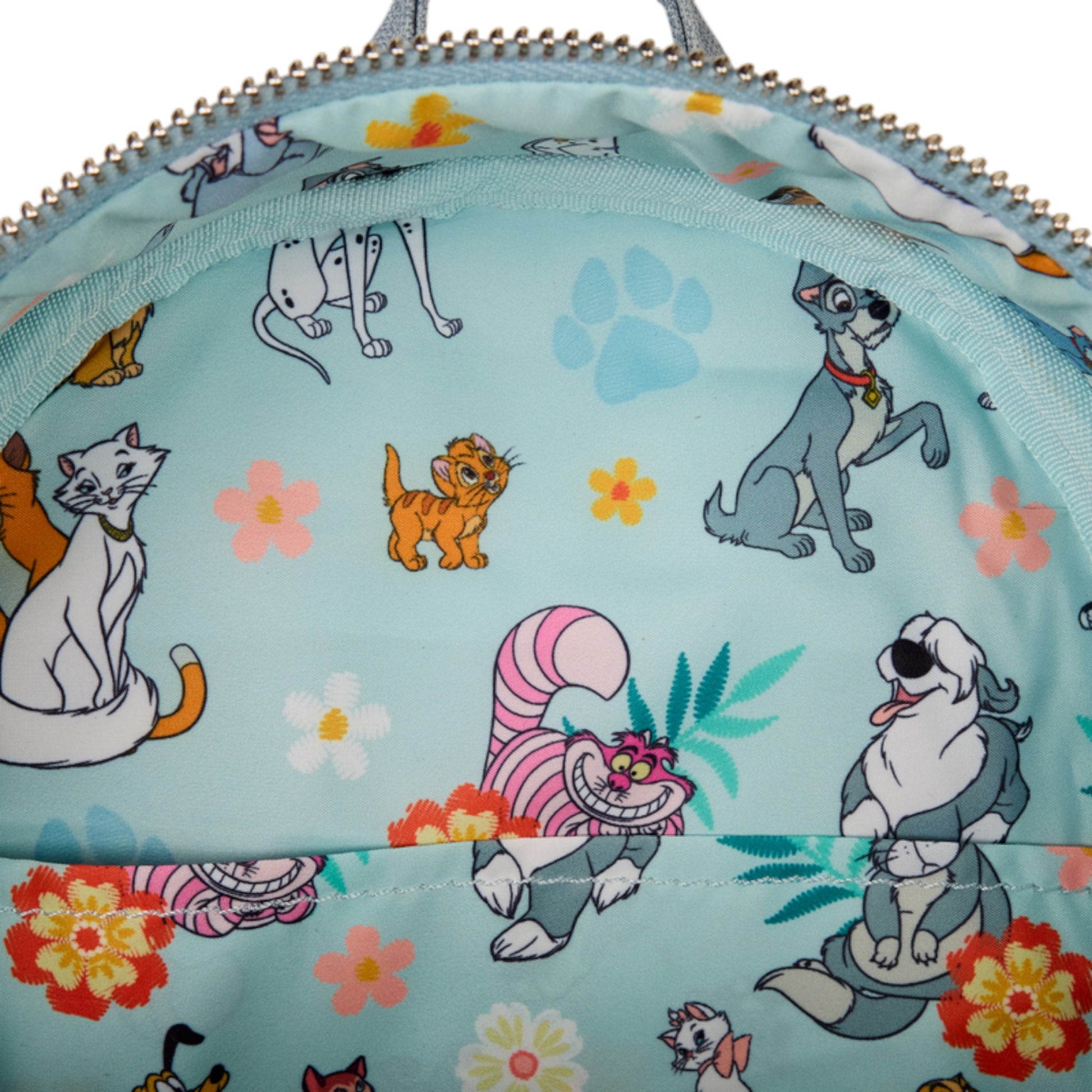 Backpack with cats and dog characters and floral patterns on a light blue background