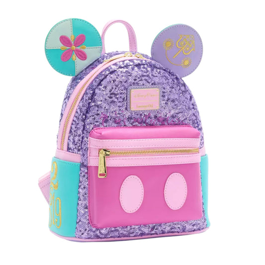 Colorful Mickey Mouse Main Attraction It's a Small World backpack with mouse ears and floral design on a white background
