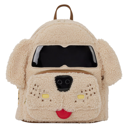 A dog-shaped teddy fleece backpack in beige, featuring a black face window, black nose, yellow nose patches, a red tongue, and brown ears and top handle.