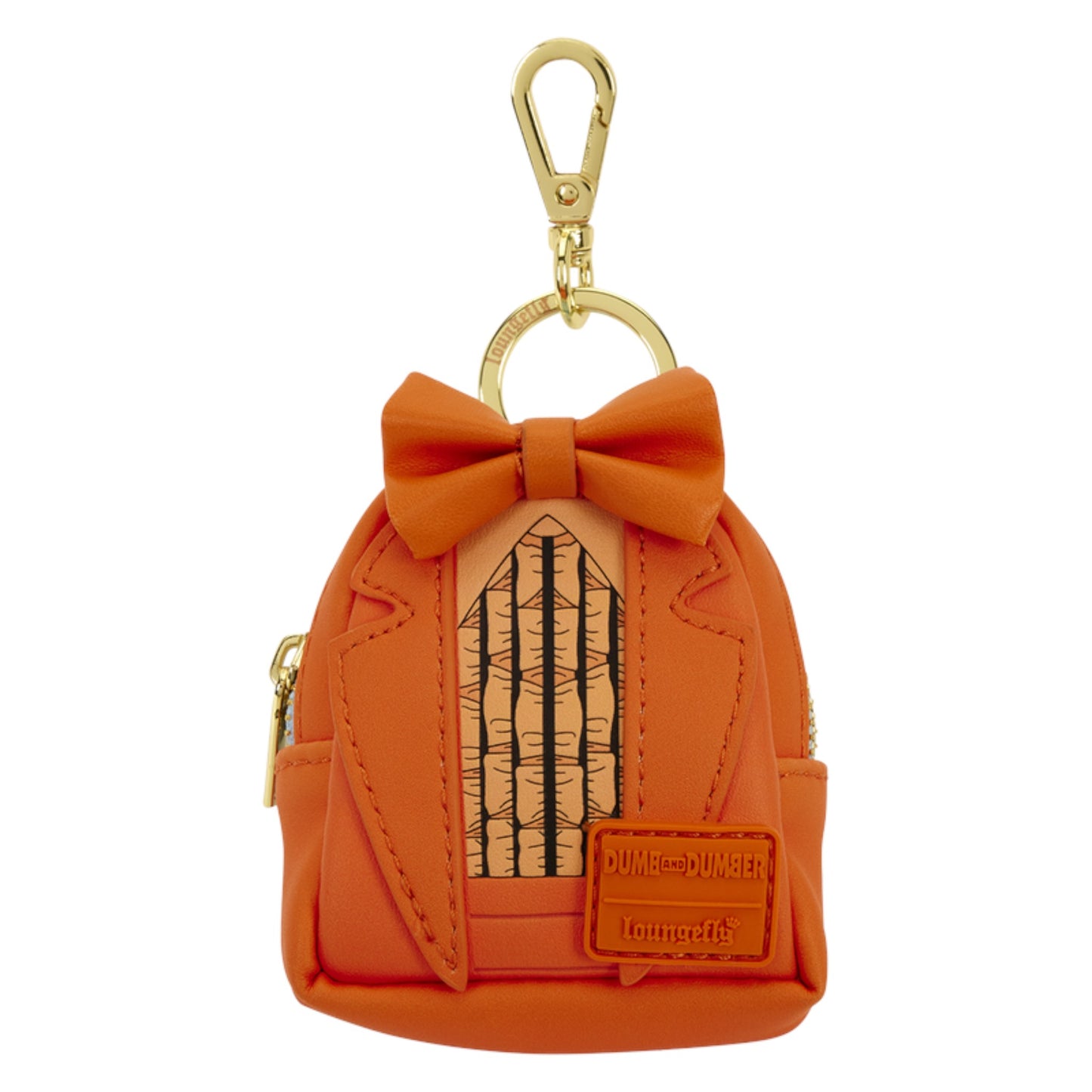 An orange mini backpack keychain designed as a Dumberler jacket, featuring a matching orange bow on top, a gold-tone carabiner, and a faux-leather patch with the text 'DUMBERLEDER' and 'Furniture'.