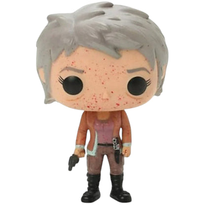 Funko Pop! vinyl figure of Carol Peletier with gray hair holding a gun and a detailed outfit on a white background