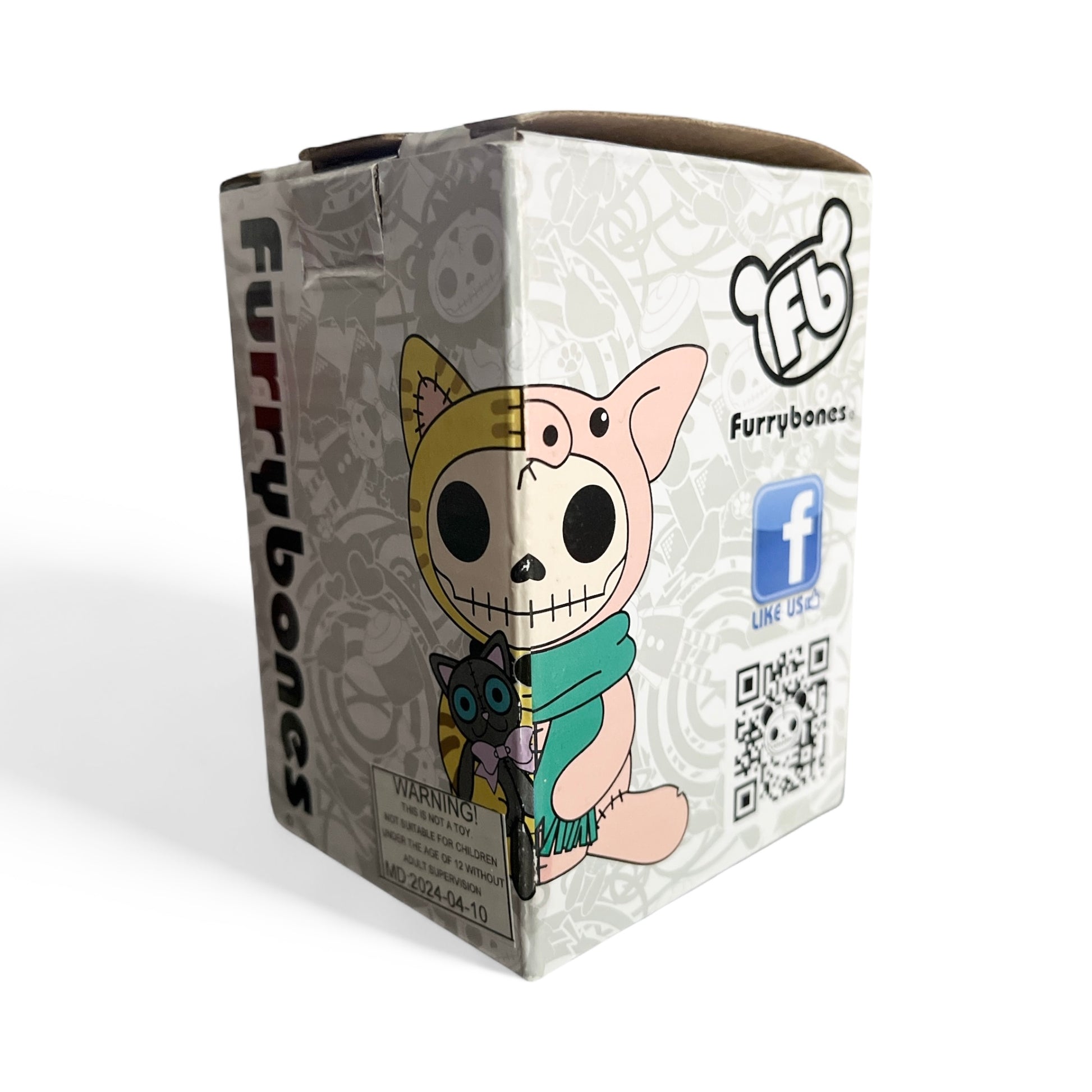 Furrybones figurine packaging with character and QR code on a white background