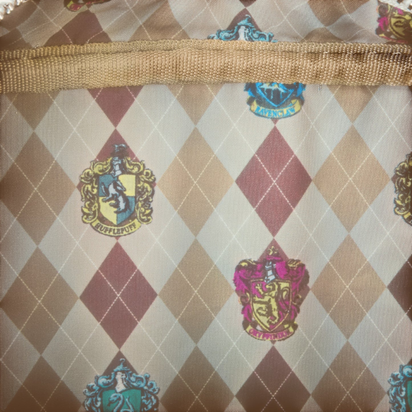 Harry Potter pattern with Hogwarts house crests on a checkered background