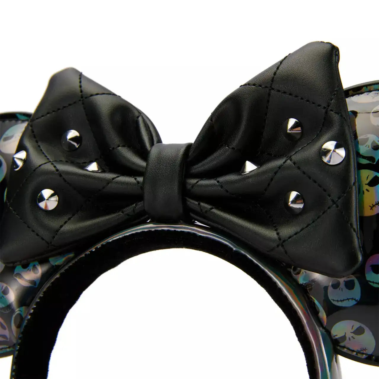 Black bow with studs on a headband with colorful skull design