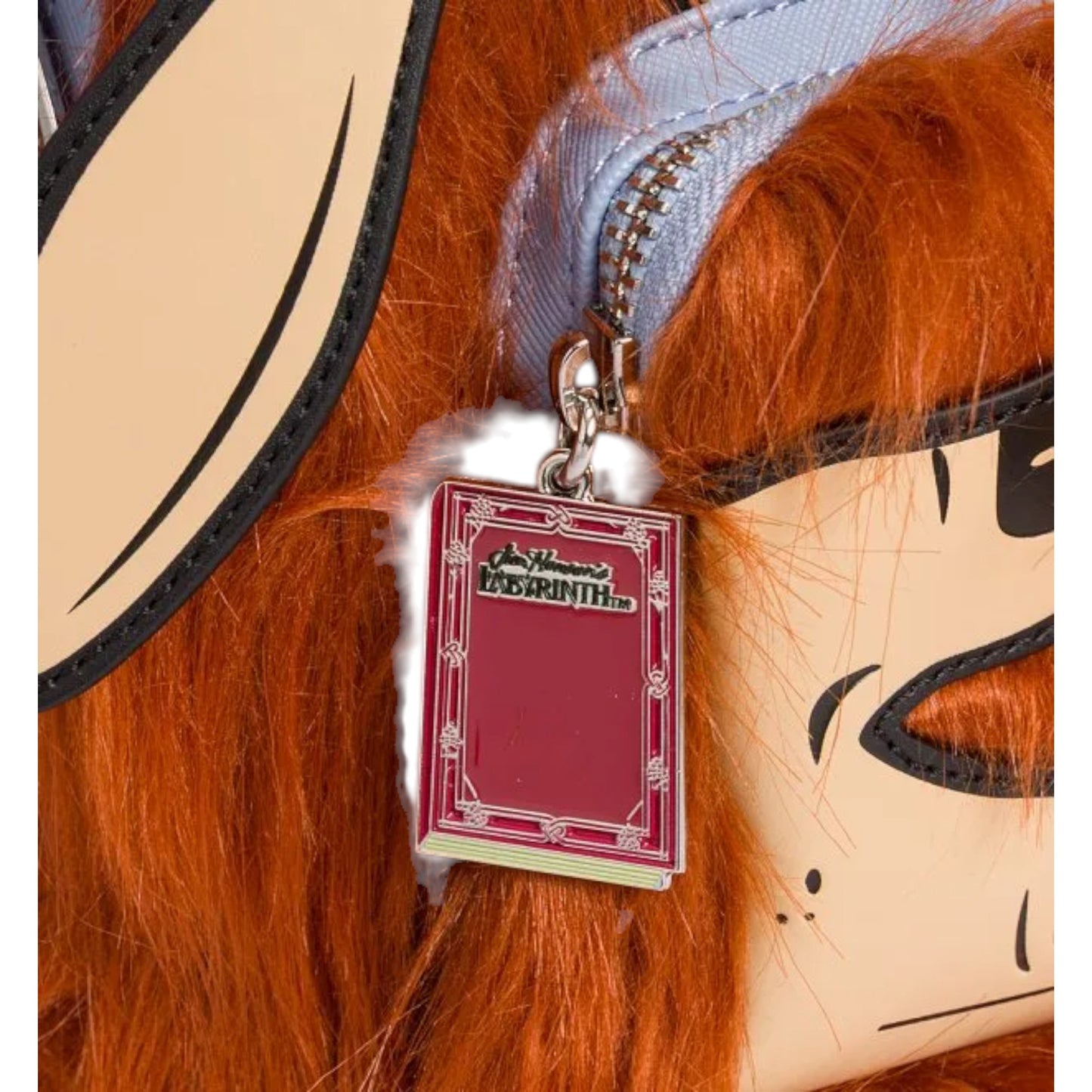 Close-up of Labyrinth Ludo Cosplay Mini Backpack with red hair and a visible zipper charm